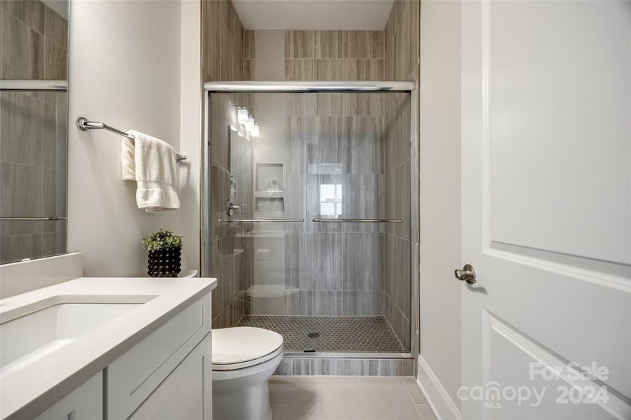 Lovely bathroom with modern designer tile.