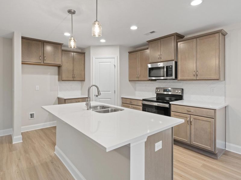 Representative furnished interior of a home built from the The Asheville D by Davidson Homes LLC in Bailey Park, Fayetteville (Image 4). Representative furnished interior of a home built from the The Asheville D by Davidson Homes LLC in Bailey Park, Fayetteville (Image 4).