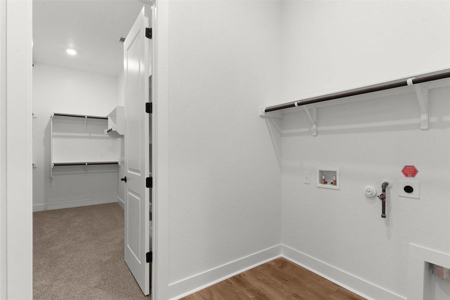 Laundry area featuring washer hookup, hookup for a gas dryer, and electric dryer hookup