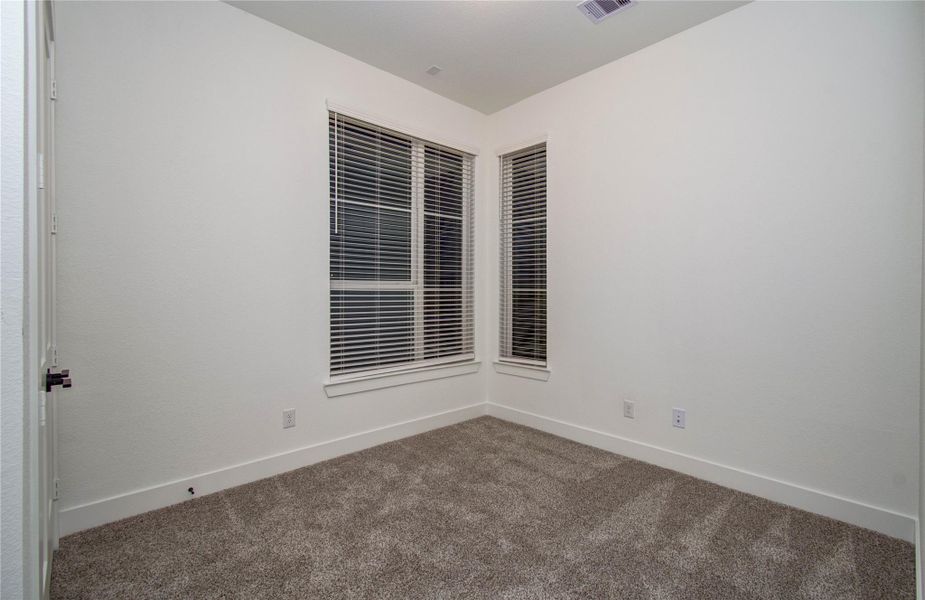 Secondary room at front of home with view of front yard!