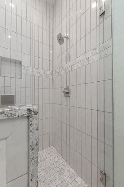 Bathroom with a tile shower