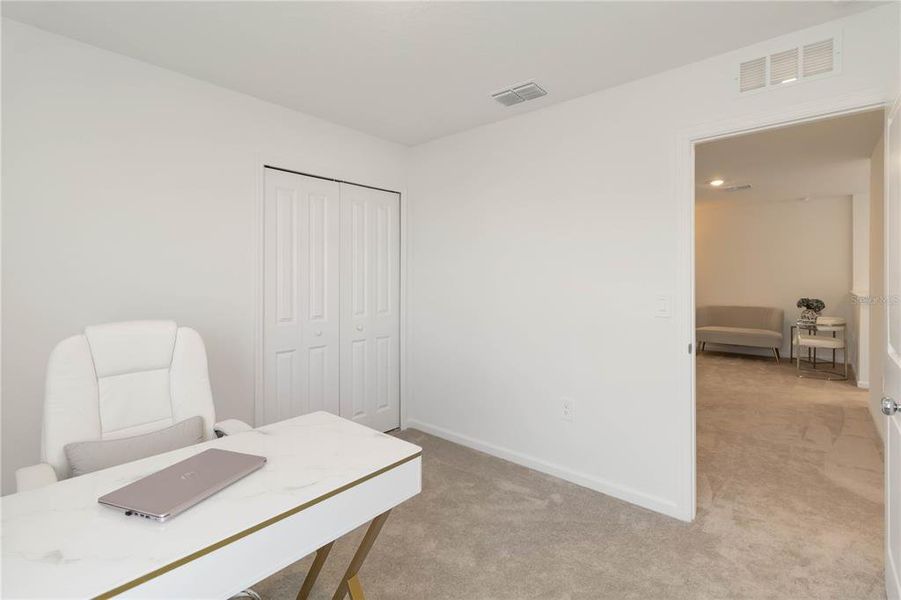 Furnished interior view inside a new home in Peace Creek Reserve: Manor Key Collection, Winter Haven (Image 38).