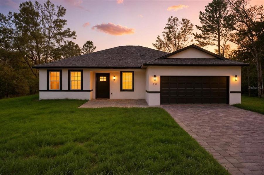 Front exterior of a new home in , Citrus Springs, FL, highlighting curb appeal (Image 1).