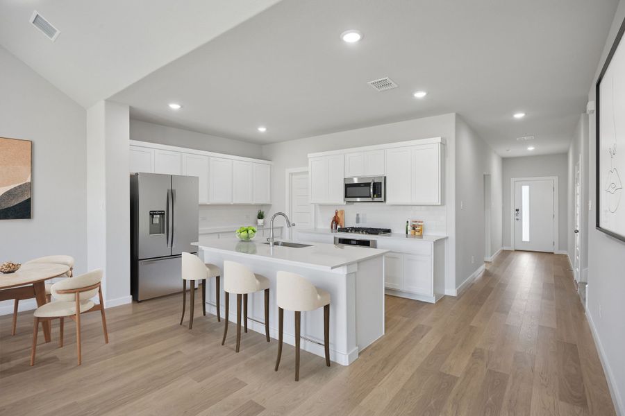 Kitchen in the Masters home plan by Trophy Signature Homes – REPRESENTATIVE PHOTO