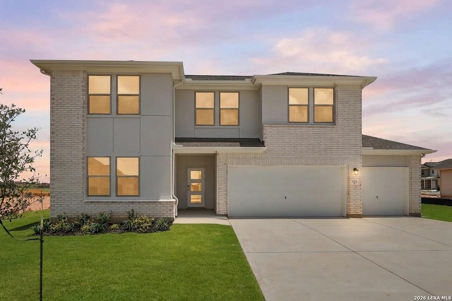 Front exterior of a new home in Hickory Ridge, Elmendorf, TX, highlighting curb appeal (Image 1). Front exterior of a new home in Hickory Ridge, Elmendorf, TX, highlighting curb appeal (Image 1).