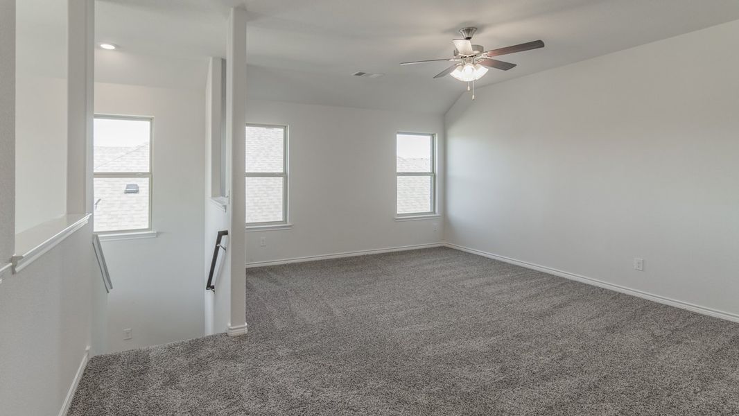 Representative unfurnished interior of a home built from the Medbourne by D.R. Horton in Woodcreek, Fate (Image 11).