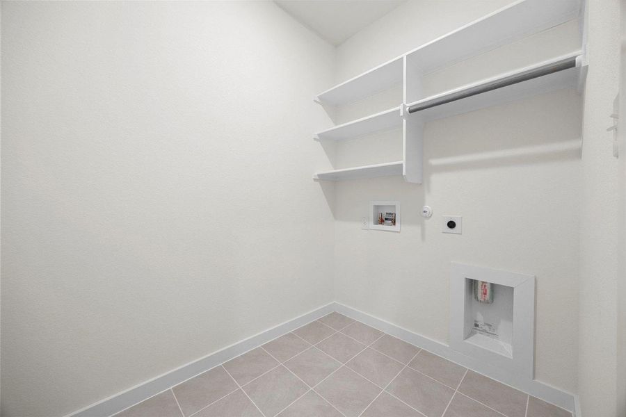 Utility Room in the Sabine home plan by Trophy Signature Homes – REPRESENTATIVE PHOTO