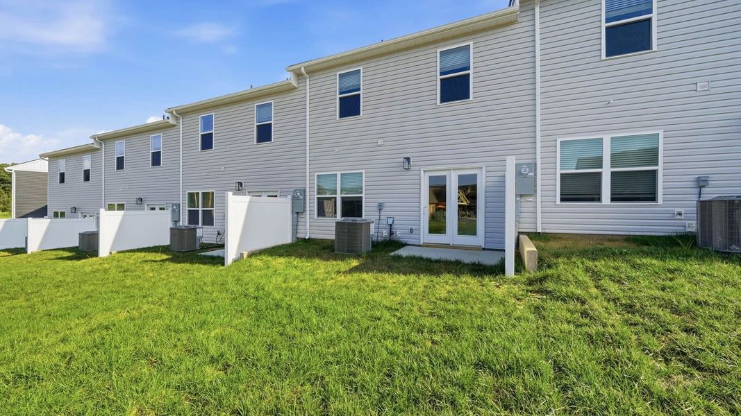 Exterior details and patio area of a home in The Arbor Townhomes, Kingsport (Image 3).