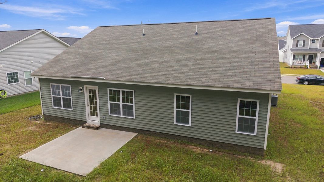 Exterior details and patio area of a home in Davenport Farms, Winterville (Image 25).