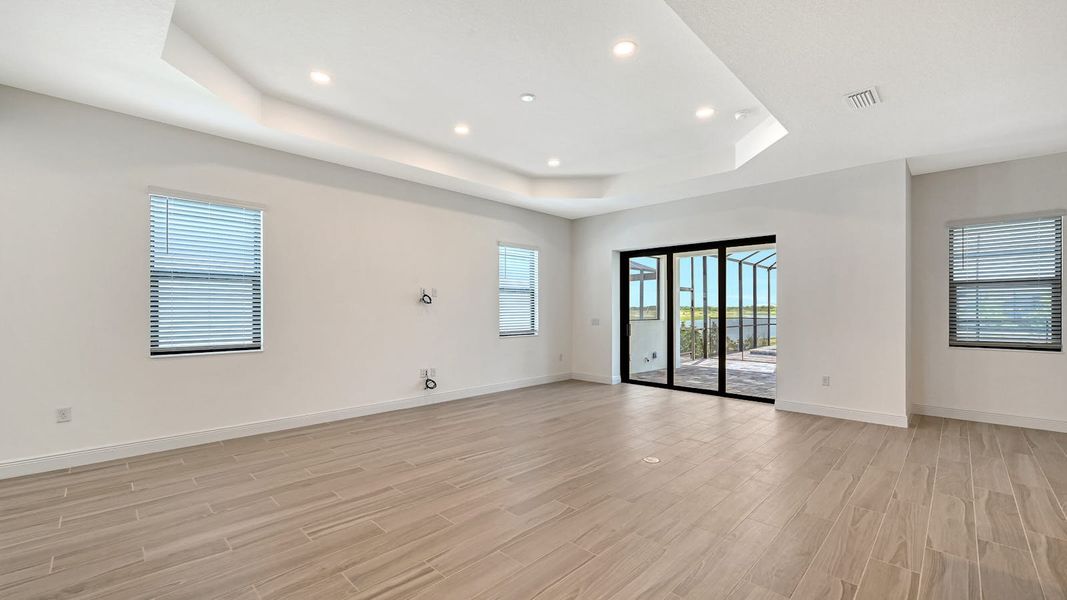 Spacious, unfurnished interior of a new home in Palm Grove Real Estate and Homes for Sale in Lakewood Ranch, FL - Neal Communities, Bradenton (Image 13).
