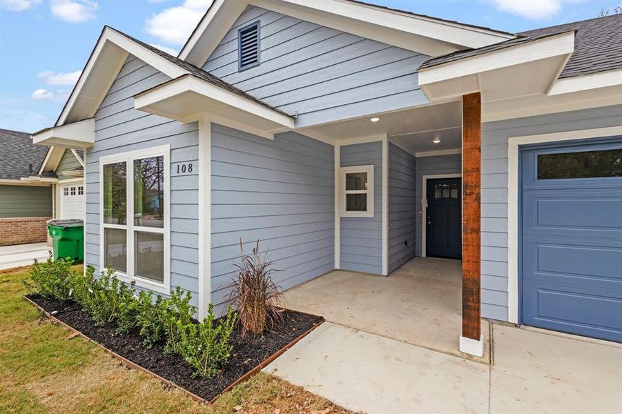 Entrance to property with a garage