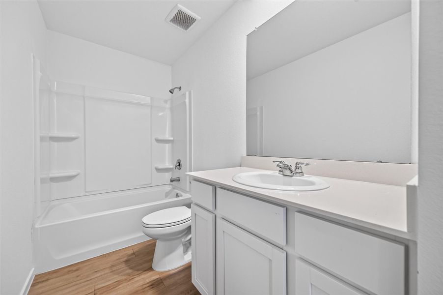 Secondary bathroom has tub shower combo. Secondary bathroom has tub shower combo.