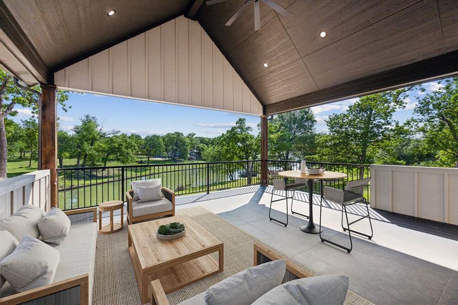 View of patio / terrace with an outdoor living space and view of wooded area View of patio / terrace with an outdoor living space and view of wooded area