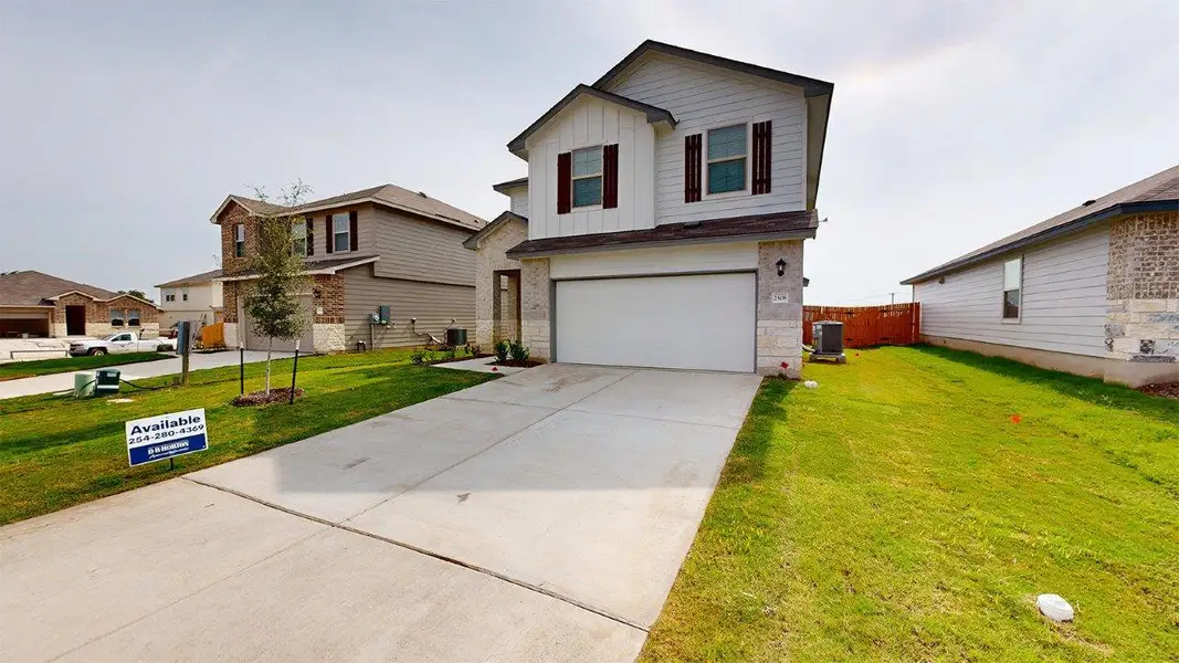 Front exterior of a new home in Pecan Creek, Temple, TX, highlighting curb appeal (Image 2). Front exterior of a new home in Pecan Creek, Temple, TX, highlighting curb appeal (Image 2).