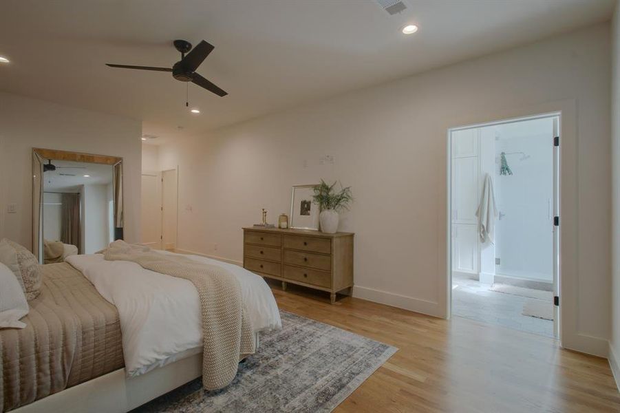 Bedroom with light hardwood / wood-style flooring and ceiling fan