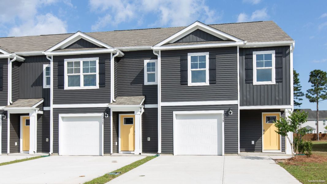 Front exterior of a new home in The Landing at Sidbury Station, Castle Hayne, NC, highlighting curb appeal (Image 1). Front exterior of a new home in The Landing at Sidbury Station, Castle Hayne, NC, highlighting curb appeal (Image 1).