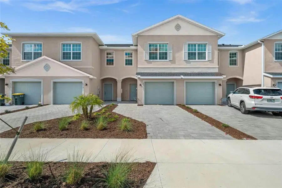 Front exterior of a new home in Tuckers Cove, Punta Gorda, FL, highlighting curb appeal (Image 2). Front exterior of a new home in Tuckers Cove, Punta Gorda, FL, highlighting curb appeal (Image 2).
