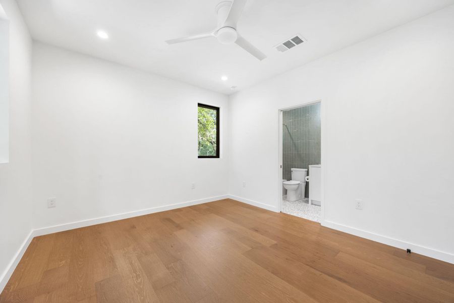 Empty room featuring wood finished floors, recessed lighting, and a ceiling fan