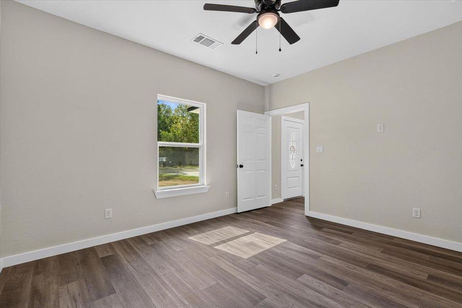 Rich wood-look flooring and a classic window frame establish a welcoming, clean-lined interior space. Rich wood-look flooring and a classic window frame establish a welcoming, clean-lined interior space.