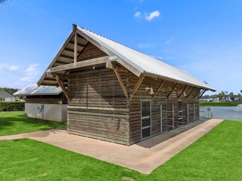 Front exterior of a new home in Woodshore, Clute, TX, highlighting curb appeal (Image 2).