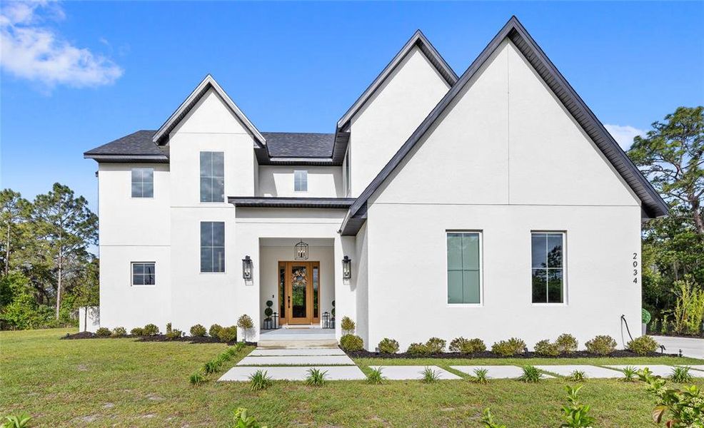 Front exterior of a new home in , St. Cloud, FL, highlighting curb appeal (Image 26).