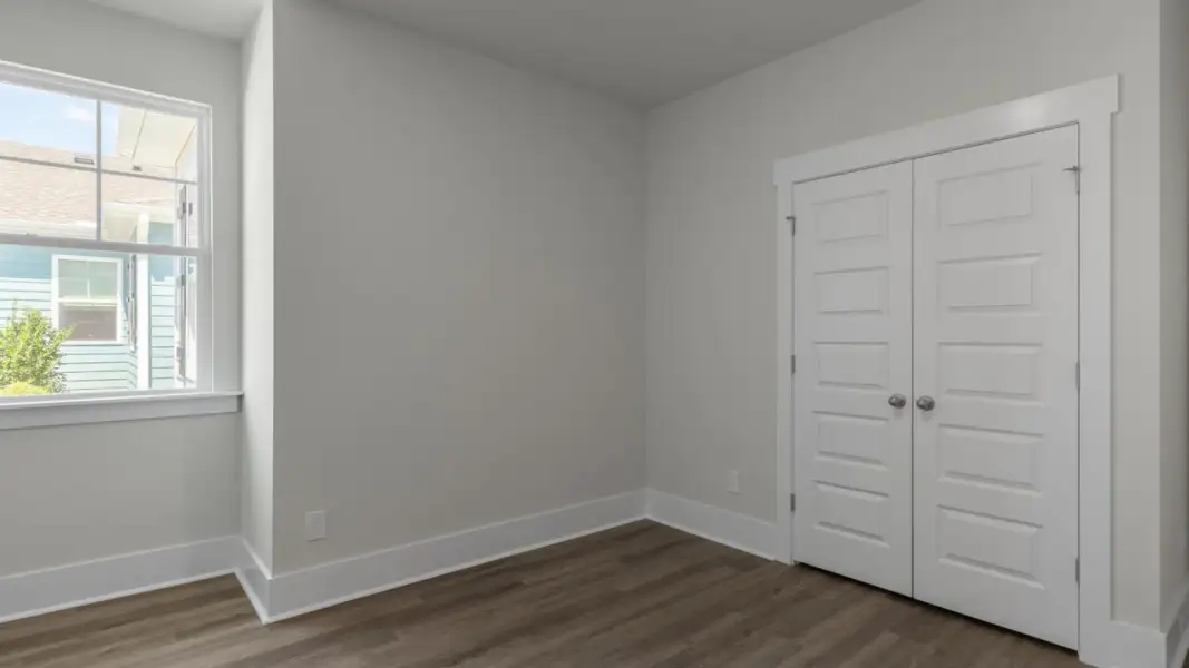 Spacious, unfurnished interior of a new home in The Retreat at Indigo Preserve Townhomes, Leland (Image 28).