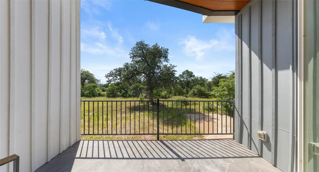 A covered deck made for golden hour — sip a glass of wine and take in the view as the sun goes down. Model No. 105 Shown.