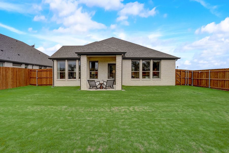 Yard in the Stanley II home plan by Trophy Signature Homes - REPRESENTATIVE PHOTO