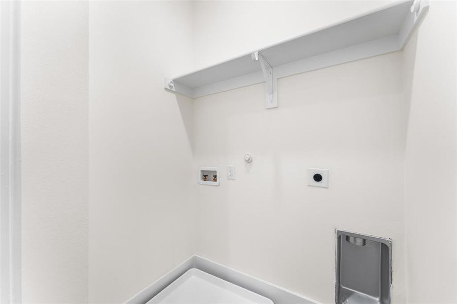 Washroom with electric dryer hookup, and a hookup for a washing machine. Washroom with electric dryer hookup, and a hookup for a washing machine.