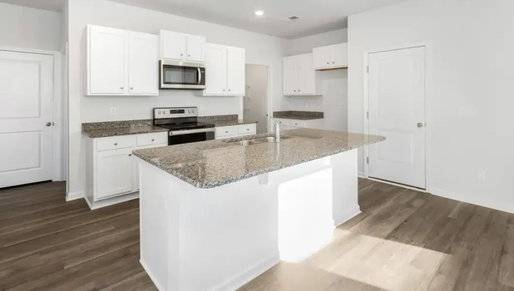 Furnished interior view inside a new home in Saunders Village, Northwest (Image 6). Furnished interior view inside a new home in Saunders Village, Northwest (Image 6).