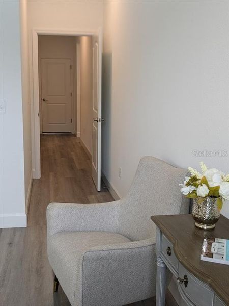 HALLWAY TO PRIMARY BEDROOM MODEL HOME