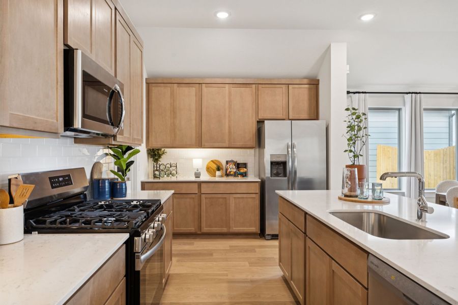 Kitchen in the Diamond home plan by Trophy Signature Homes – REPRESENTATIVE PHOTO Kitchen in the Diamond home plan by Trophy Signature Homes – REPRESENTATIVE PHOTO