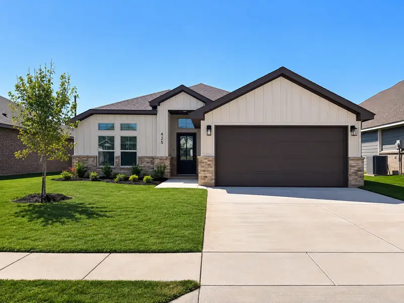Front exterior of a new home in Craftsman's Corner, Cleburne, TX, highlighting curb appeal (Image 1). Front exterior of a new home in Craftsman's Corner, Cleburne, TX, highlighting curb appeal (Image 1).