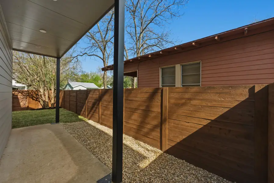 Fenced backyard with a patio area