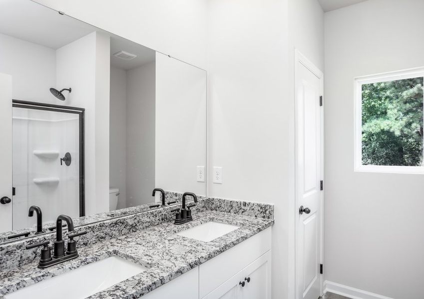 The master bathroom has double sinks