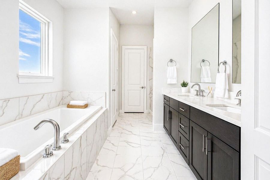 Light-filled primary bathroom.   Minimum virtual staging added.