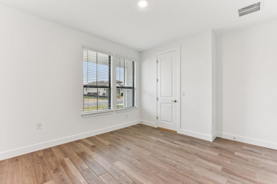 Spare room with light wood-style floors and recessed lighting Spare room with light wood-style floors and recessed lighting