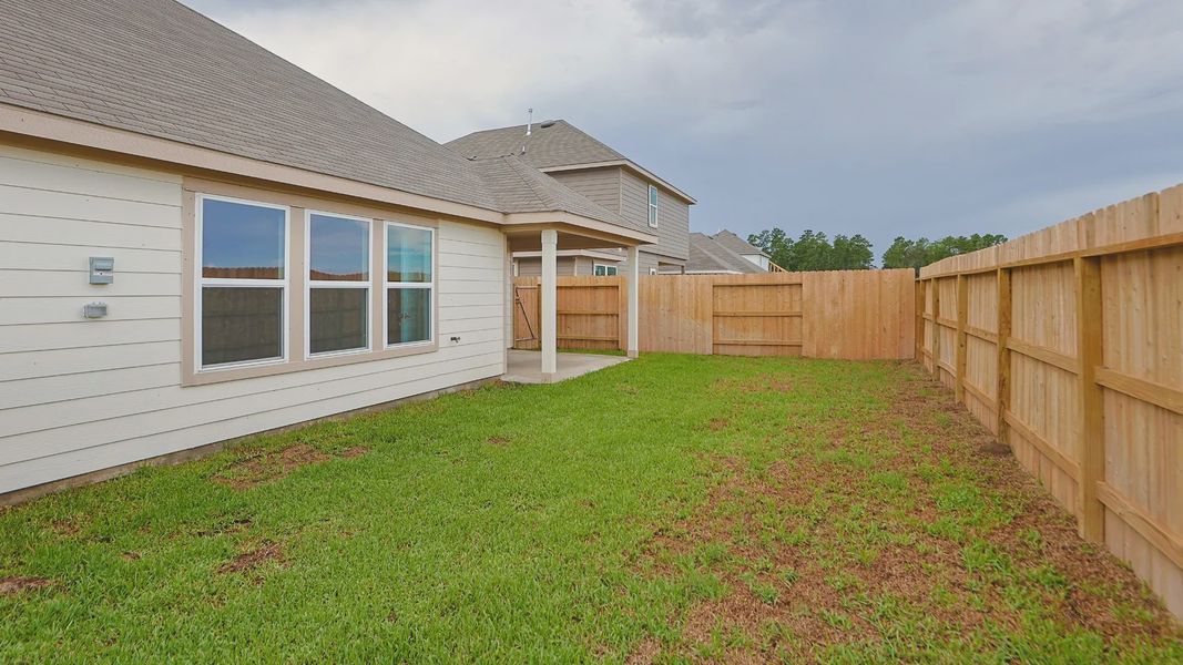 Exterior details and patio area of a home in Mostyn Springs, Magnolia (Image 20).
