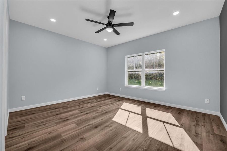 Unfurnished room featuring wood finished floors, recessed lighting, and ceiling fan Unfurnished room featuring wood finished floors, recessed lighting, and ceiling fan