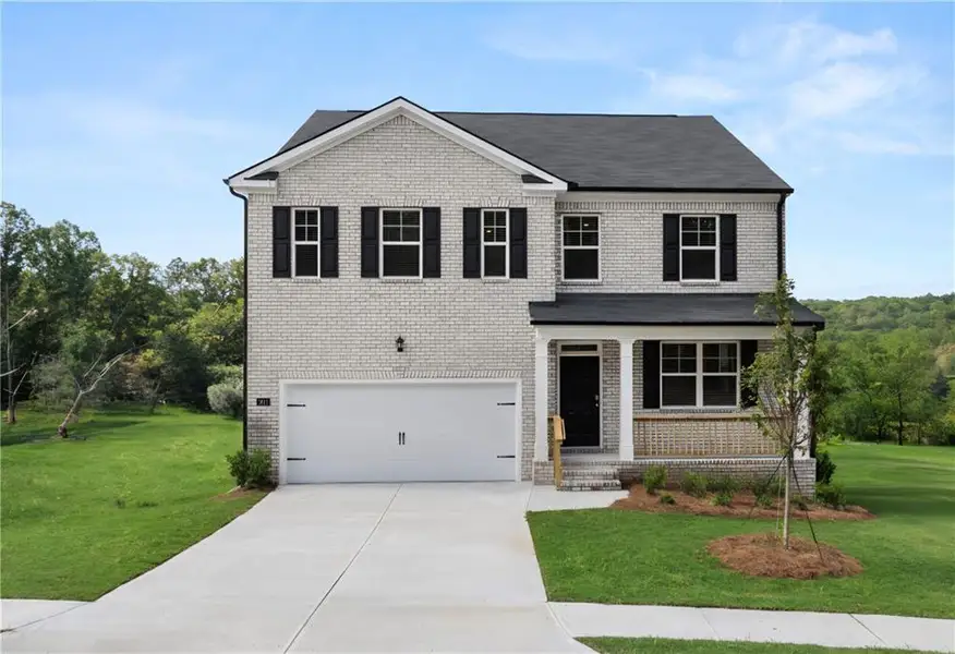 Front exterior of a new home in Bridle Creek, Locust Grove, GA, highlighting curb appeal (Image 1). Front exterior of a new home in Bridle Creek, Locust Grove, GA, highlighting curb appeal (Image 1).