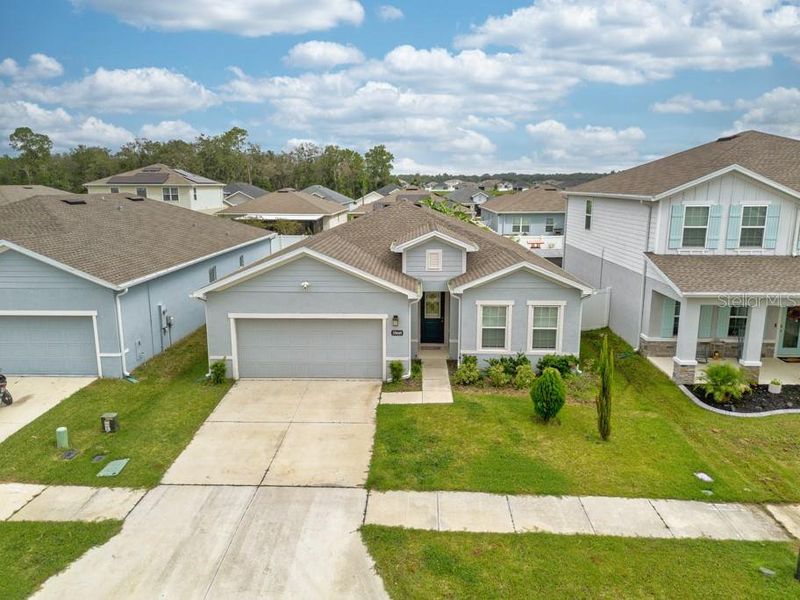Front exterior of a new home in , Zephyrhills, FL, highlighting curb appeal (Image 22).