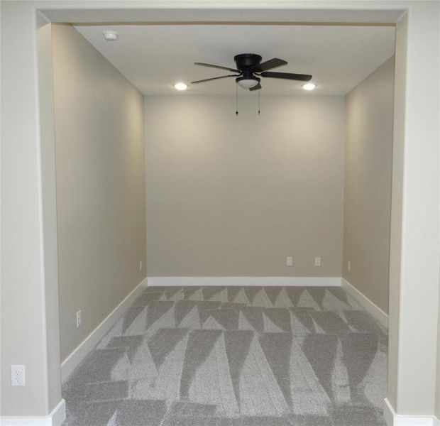 Media room with carpet and ceiling fan