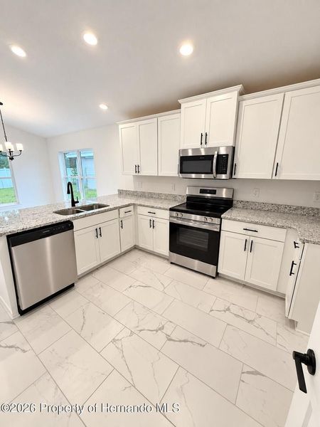 Furnished interior view inside a new home in Winding Oaks, Weeki Wachee (Image 3).