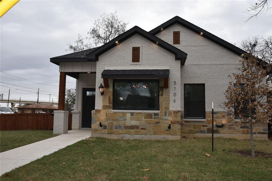 View of front of home with a front yard