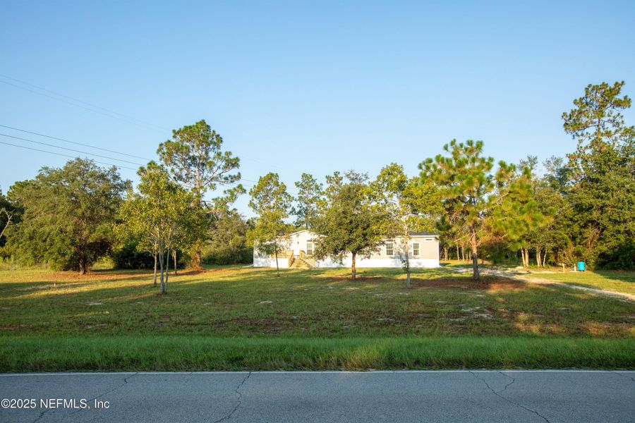 Front exterior of a new home in , Keystone Heights, FL, highlighting curb appeal (Image 2). Front exterior of a new home in , Keystone Heights, FL, highlighting curb appeal (Image 2).