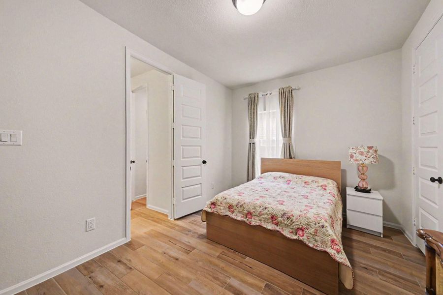 Another charming secondary bedroom with a walk-in closet. Another charming secondary bedroom with a walk-in closet.