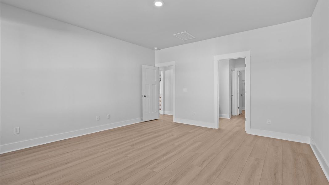 Memorable mornings begin in this tasteful and thoughtfully crafted primary suite