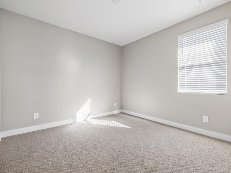 Spacious, unfurnished interior of a new home in Blossom Rock Reserve Series, Apache Junction (Image 13).