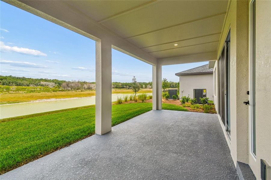 Exterior details and patio area of a home in Oakfield at Mount Dora Village Series, Mount Dora (Image 3).