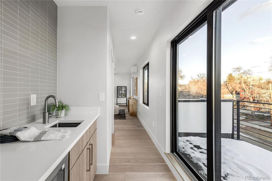 Third floor wet bar and side deck